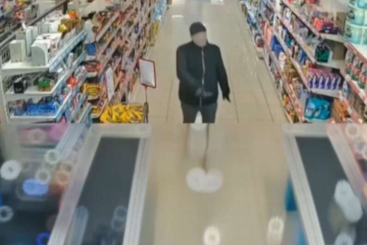 Yüzüne kadın çorabı geçirerek marketin kasasını boşalttı