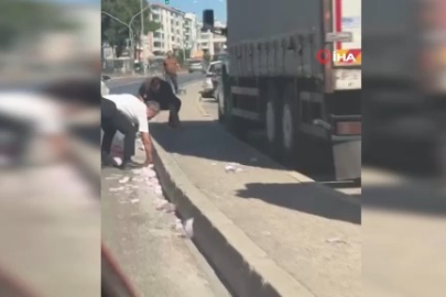 İzmir'de yola saçılan para desteleri kamerada