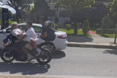 Cadde ortasında akılalmaz hareket: 1 motosiklette 3 kişi